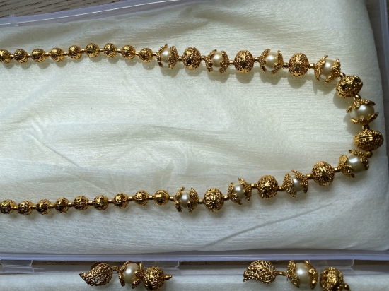 Picture of Gold Nakshi Balls and perl chain with earrings