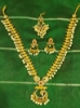 Picture of Small Lakshmi coin necklace with Tikka