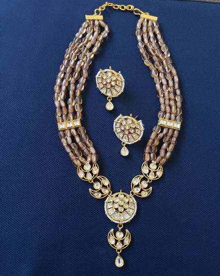 Picture of tyaani kundan brown beads necklace set