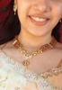 Picture of tyaani kundan brown beads necklace set