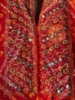 Picture of Red Bandhini dress with mirror work on yoke