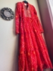 Picture of Red Bandhini dress with mirror work on yoke