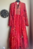 Picture of Red Bandhini dress with mirror work on yoke