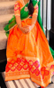 Picture of Orange and green half saree
