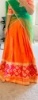 Picture of Orange and green half saree