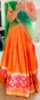 Picture of Orange and green half saree