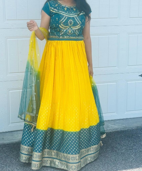 Picture of Brand New Crop top  Lemon yellow and Green color top mirror work on it,Gold color print on skirt .