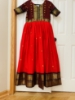 Picture of Tomato red and brown pattu  silk Long  dress with double  border and body yoke