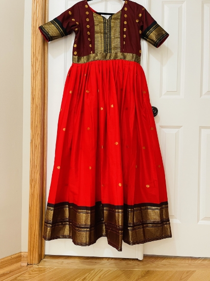 Picture of Tomato red and brown pattu  silk Long  dress with double  border and body yoke