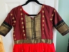 Picture of Tomato red and brown pattu  silk Long  dress with double  border and body yoke