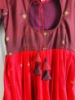 Picture of Tomato red and brown pattu  silk Long  dress with double  border and body yoke