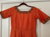 Picture of Orange Silk dress with maggam work