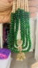 Picture of Gold sheeted Grand 4 lines greens and Swaroski pearls mala