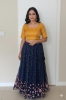 Picture of Navy blue netted lehenga with benaras blouse