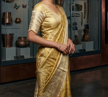Picture of Gold and cream Kanchi tissue saree