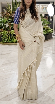 Picture of Elegant Ivory silver fancy saree with stylish blue Banaras  Blouse.