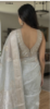Picture of Pastel Pista color soft lightweigh Saree with stylish sleeveless blouse